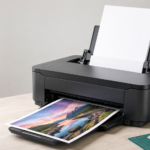 Heavyweight paper being loaded into the rear feed of a desktop inkjet printer
